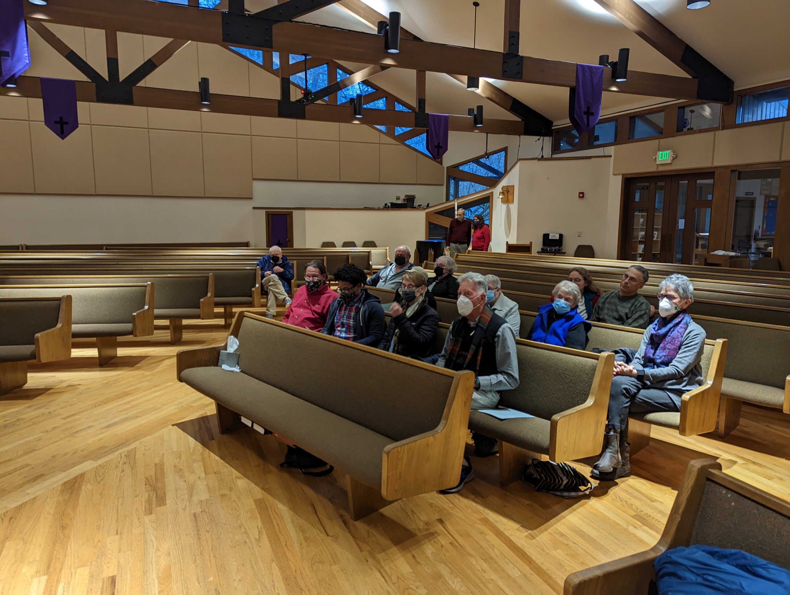 People sitting in church pews