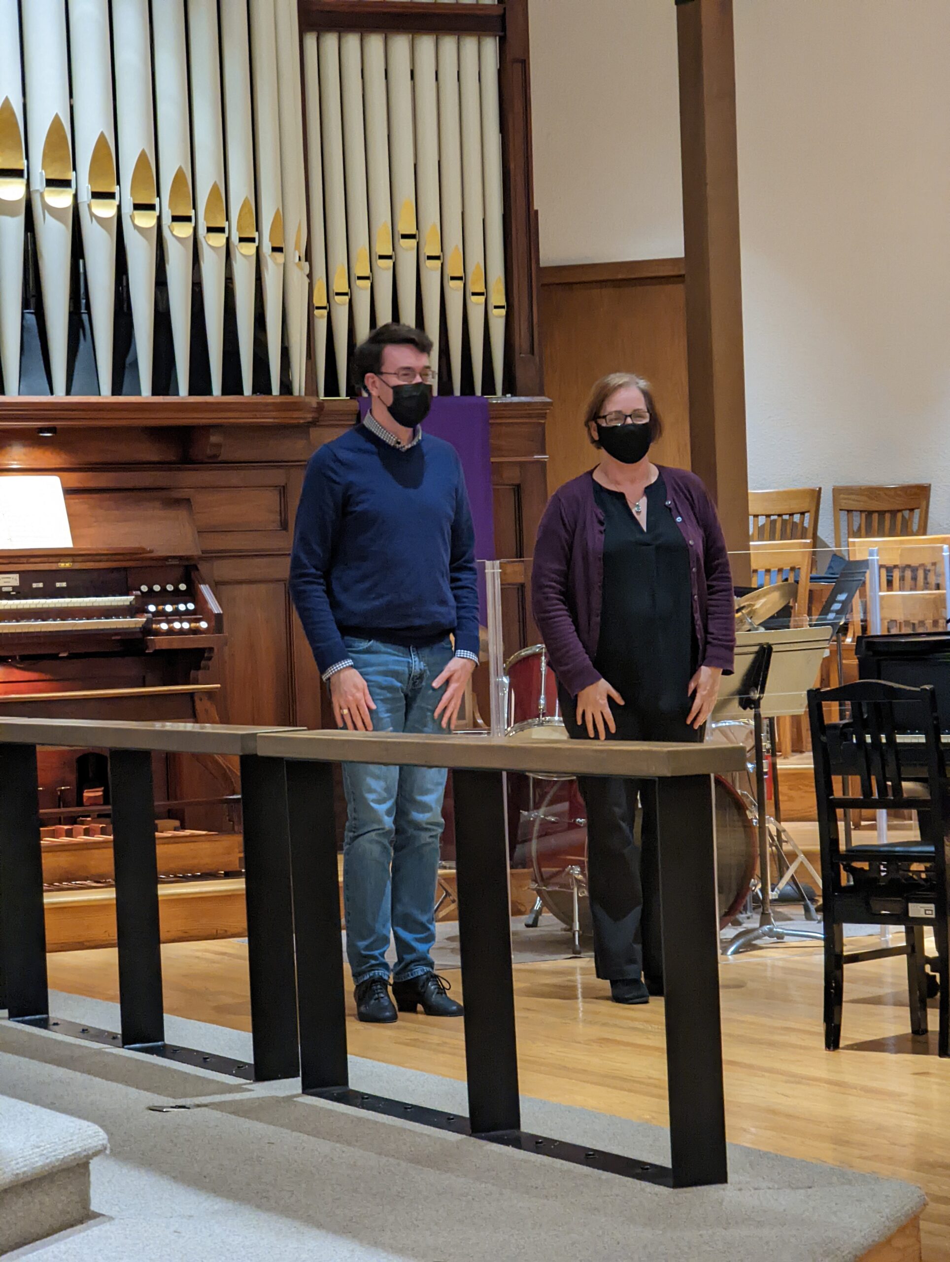 Wyatt Smith and Sheila Bristow standing in front of organ at front of church
