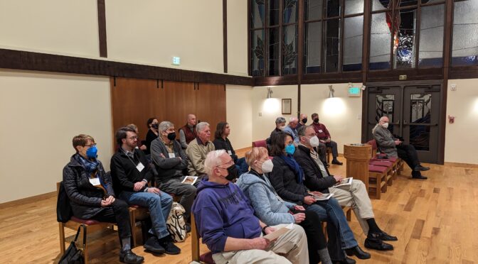 Group of people sitting in chairs